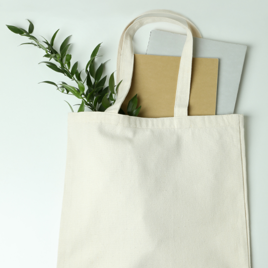 Image of a tote bag and notebooks